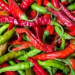 Close-up of vibrant red and green chilies showcasing freshness and spice.